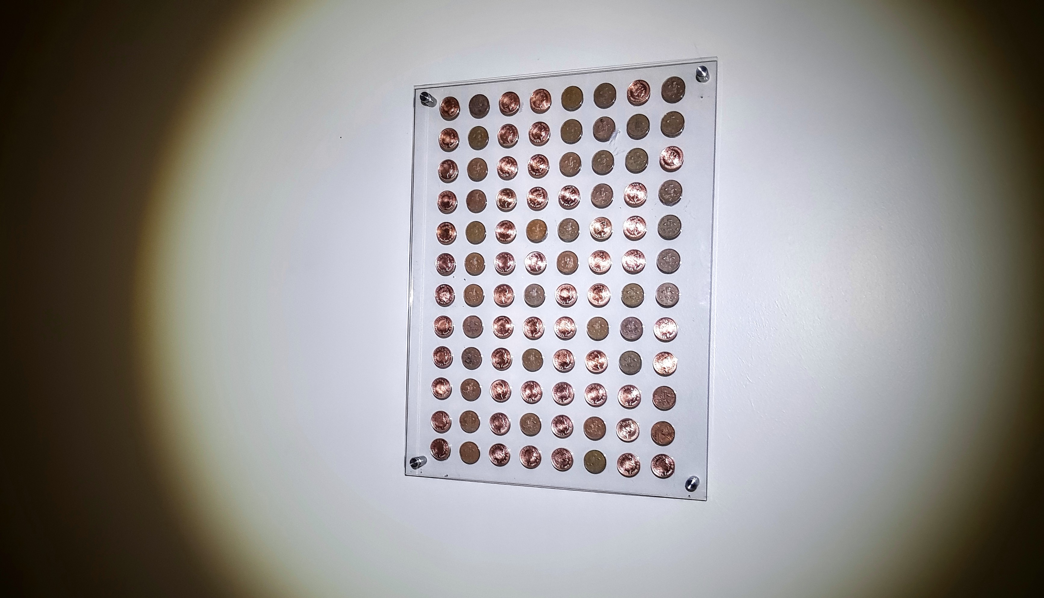 Ones and Zeros — a grid of ninety-six two-pence coins
